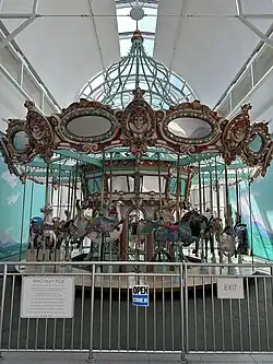 The indoor carousel of Arden Fair with its painted rideable animals