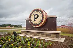 Town of Pembroke welcome sign. "Town. Tribe. University."