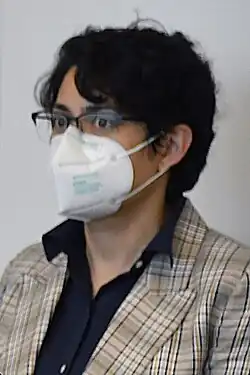 photo of a woman with short hair wearing glasses
