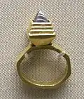Gold finger ring with garnet inlay (BM)