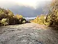 the river Arve in a period of floodings as it joins the Rhone river in Jonction (Geneva)