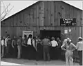 Line up for state relief pay day, Arvin, California, 1940