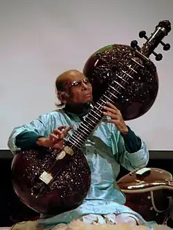 Rudra veena is a large plucked string instrument used in Hindustani classical music. One of the major types of veena played in Indian classical music, it has two calabash gourd resonators.[48] The vichitra veena, also with two large resonators, is a similar instrument.
