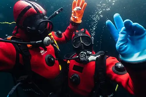 Scuba diving under the ice during the Asclepios II extreme environment training in Verbier with explorer Alban Michon.