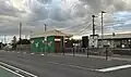Station building and entrance to Platform 2 viewed from the south end of the station, September 2025