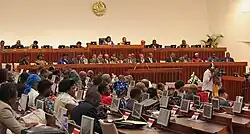 Meeting with members of Mozambique's national assembly sitting together.