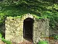 This is a defunct Grotto from Alum Rock Park. Natural spring water mixed with sulfur used to leak out. It may've stopped due to recent earthquakes or floods.