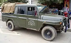 Beijing BJ2032 SAQ pickup which combines the 1965 nose with the post-2000 doors.