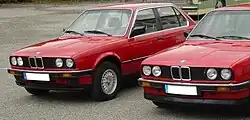 A pre-facelift (1982–1985) model parked to the left of a 1986–1987 model (first facelift).