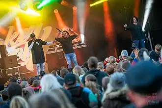 Dallas Woods performing with Baker Boy (left) and Kian (right) at Riddu Riđđu in 2018