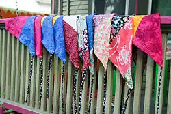 Bandanas are produced in a variety of colors and designs .