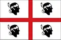 The flag of Sardinia, shows a Saint George's Cross on a white field, surrounded by four black heads, known as the Four Moors