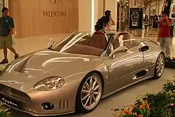 Early form: smooth arches, headlight bulb layout and a signal on the wing.