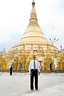 Image 36Former US President Barack Obama poses barefoot on the grounds of Shwedagon Pagoda, one of Myanmar's major Buddhist pilgrimage sites. (from Culture of Myanmar)