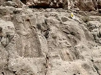 Second Barm-e Delak relief of Bahram II making gesture of piety, whilst being offered a diadem by a courtier
