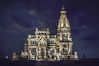Historic palace with distinctive Indo-Cambodian architecture featuring ornate spires and decorative facades