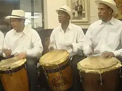 Puerto Ricans playing the Barril drum traditionally used in Bomba music