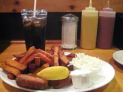 Crab cakes with sweet potato fries, coleslaw, and tartar sauce
