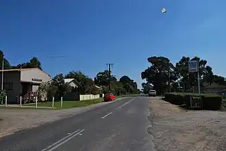 The main street of Barwon Downs with the public hall on the left and the general store on the right (now closed)