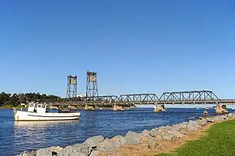 Looking towards the former Batemans Bay Bridge from the banks of the Clyde River which flows into the bay.