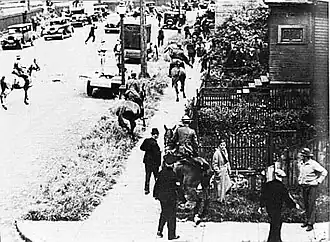 Image 6Mounted police chase demonstrators through Vancouver's East End during the Battle of Ballantyne Pier in 1935.