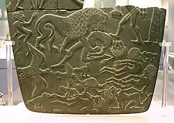 Possible prisoners and wounded men of the Buto-Maadi culture devoured by animals, while one is led by a man in long dress, probably an Egyptian official (fragment, top right corner). Battlefield Palette.[69][75]