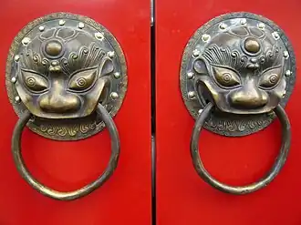 Image 61A traditional red Chinese door with Imperial guardian lion knocker (from Chinese culture)