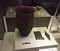 Beaker, wrist-guard with gold studs, copper dagger and toggle.[210]