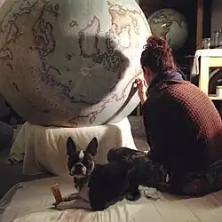 A large globe being painted