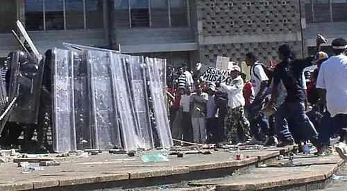Image 13Riot police and protesters during the unrest in 2005. (from History of Belize)