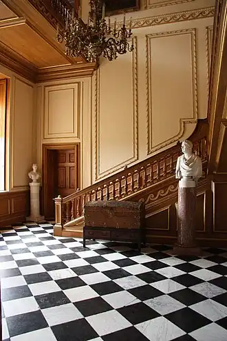 Staircase with marble statues at each side
