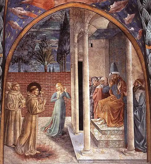 A fresco depicting three friars standing before a bearded and crowned man sitting on a throne surrounded by soldiers and bearded men