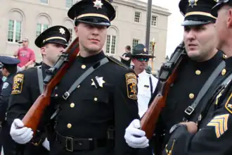 A Berks County deputy sheriff wearing a mourning band on his badge, in Washington, DC, 2012[4]