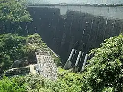 Bhumibol Dam, 154 metres (505&nbsp;ft) long, creating a reservoir with a surface area of 300 square kilometres (120&nbsp;mi2).