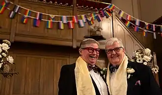 A couple getting married at the Big Gay Wedding event