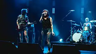 Vail singing with Bikini Kill in 2020