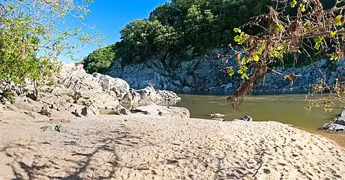 The Purplehorse "Beach". No swimming here: river is dangerous and people drown.