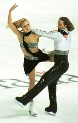 Shae-Lynn Bourne and Victor Kraatz perform on ice.