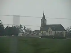 The church and surroundings in Blandainville