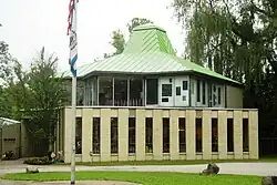 two story building with roof that looks like a hat