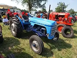 Blue Leyland 154 model agricultural tractor, shown outdoors in a front three-quarter view.