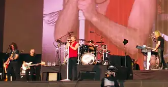 Bon Jovi performing in Hyde Park, London in 2013. From left to right: Phil X, Hugh McDonald, Jon Bon Jovi, Tico Torres, and David Bryan.