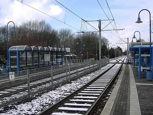 Double-tracked railway line surrounded by platforms