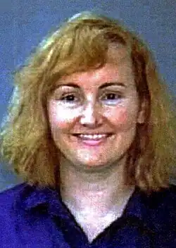 Headshot of Bakley against a blue background