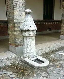 One of the three old standpipes in the playground.​​‌