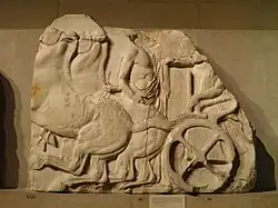 Greek sculptural panel, badly broken at right: on the left edge, an orange-brown spot similar in colour to rust can be seen.