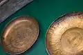 Two Phoenician bronze bowls from Nimrud on display in the British Museum