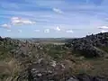 At the top of Brough Law - the nearby hill. It was once an old fort but is now just a circle of tumbled down stones.