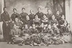 A photograph of Tsarevna Miladinova, the founder of the first Bulgarian girls' school in Thessaloniki, with teachers and students at the school.