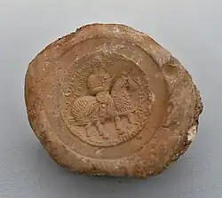 A bulla (seal) of Wahrām, an Ērān-spāhbed. It mentions either Husraw I (r.&nbsp;531–579) or II (591–626)[21]